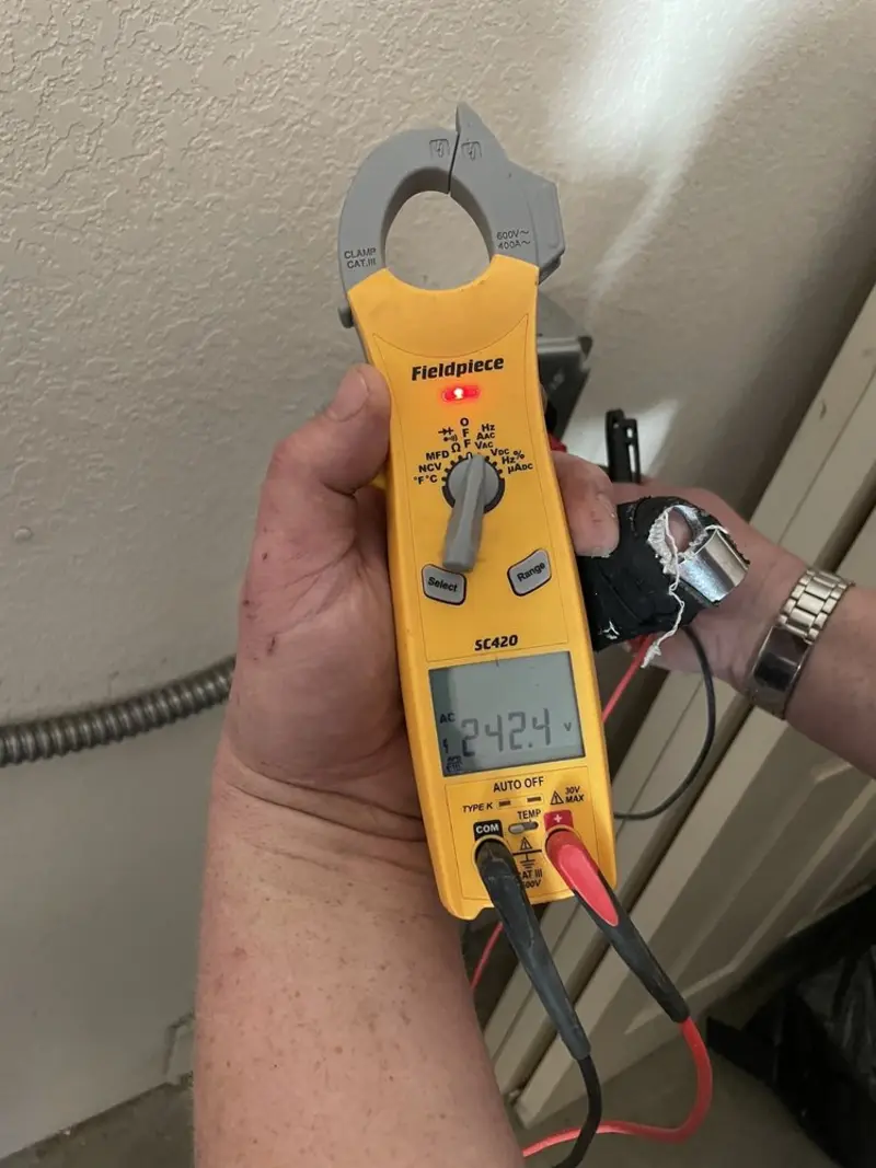 Voltage testing with clamp meter during Outlet Installation in Bloomfield
